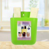 GlimmerHome 2-section wall holder neatly organizing a mobile phone and remote.