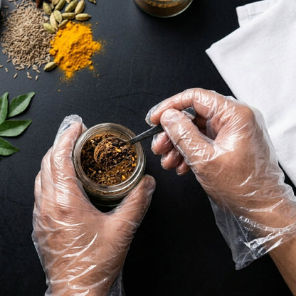 Disposable small plastic gloves in a pack, suitable for kitchen use