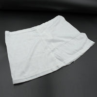 Women's high-waisted athletic skort front view in white.