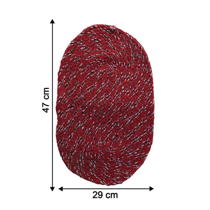 Close-up of red floor mat showing textured fabric