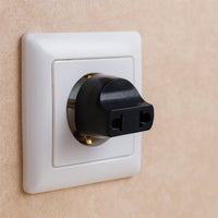 2 Pin Plug Adapter for universal to Indian sockets, shown in its color box packaging.