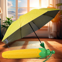 Compact vegetable shaped folding umbrella in its protective plastic case.