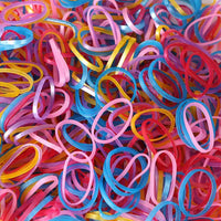 A neatly stacked pile of colorful multicolor rubber bands on a clean white background.