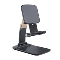 Foldable phone holder stand securely holds a smartphone on a modern desk.