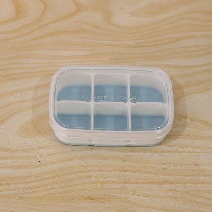 Compact home ice tray in use, perfect for small freezers and daily needs.