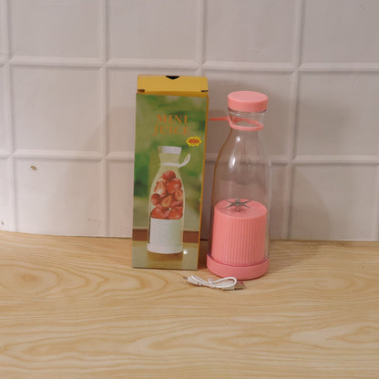 Close-up of portable electric juicer in action