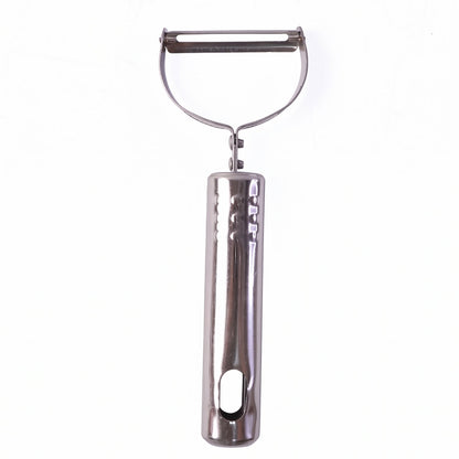 Stainless steel peeler on kitchen counter with peeled vegetables