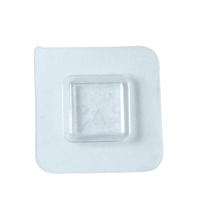 Transparent no-drill wall hook demonstrating versatile use in a home setting.